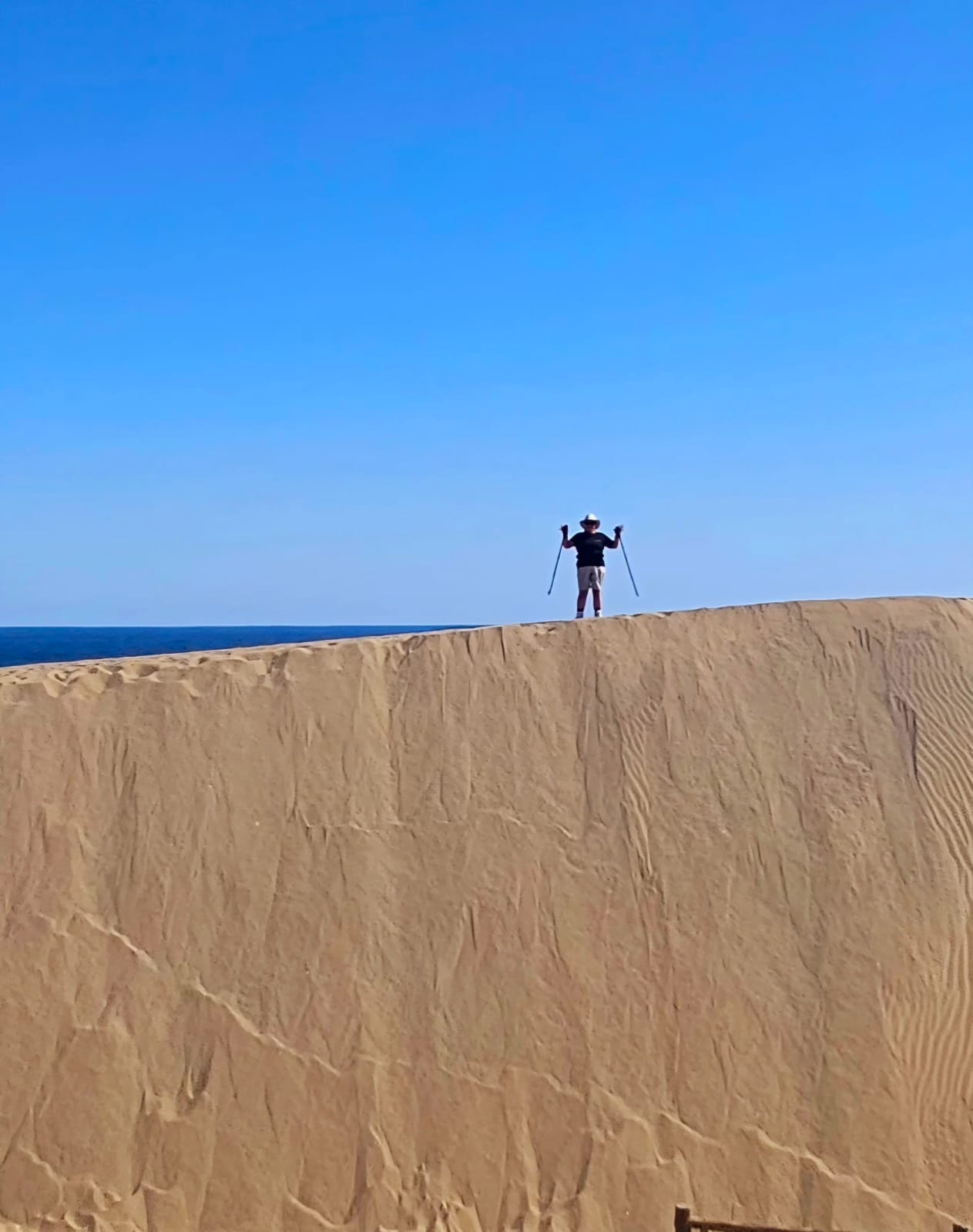 A person standing on rock mountain