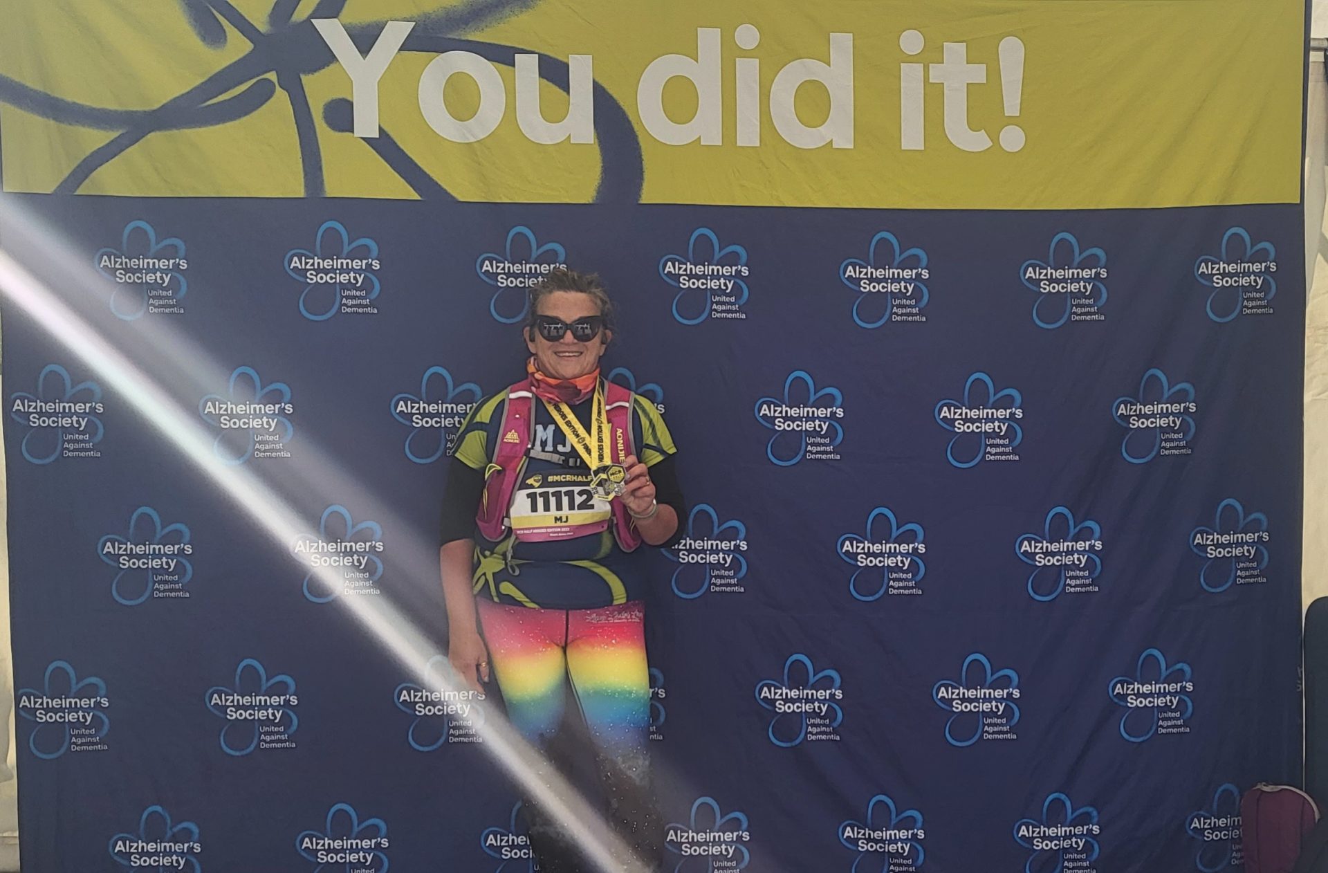 A winner holding medal in her neck